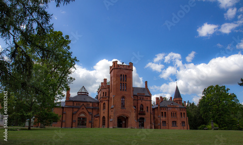 Red brick manor house in the style of English castles. photo