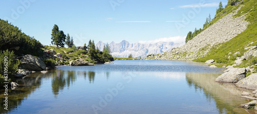 Reiteralm loop hiking trail with views on the Dachstein Mountains in Schladming, Austria.