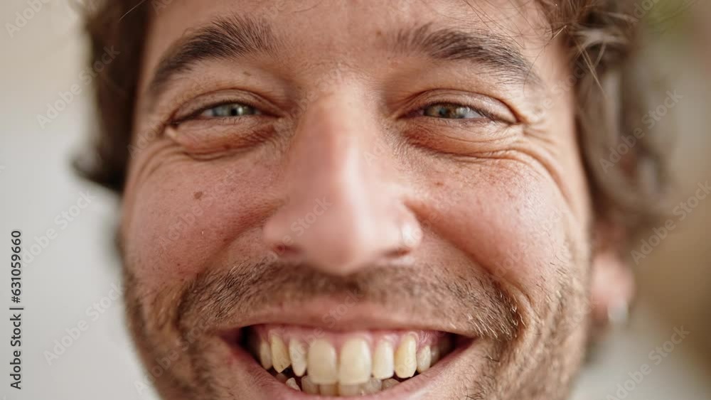 Young hispanic man smiling confident doing funny gesture with eyes at home Young hispanic man smiling confident doing funny gesture with eyes at home