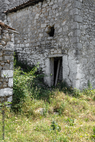 Fototapeta Naklejka Na Ścianę i Meble -  Ancient abandoned house complex, stony aged architecture