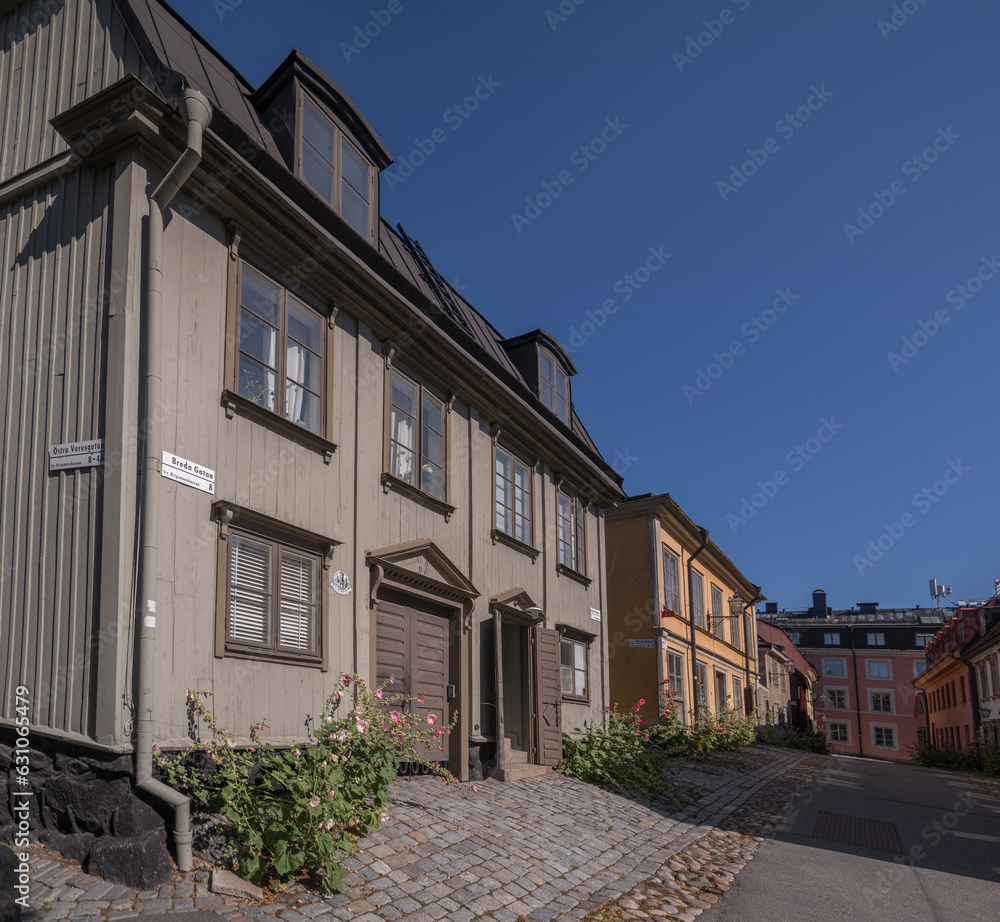  Old two flat wood 1700s houses in the island Djurgården, a sunny summer day in Stockholm