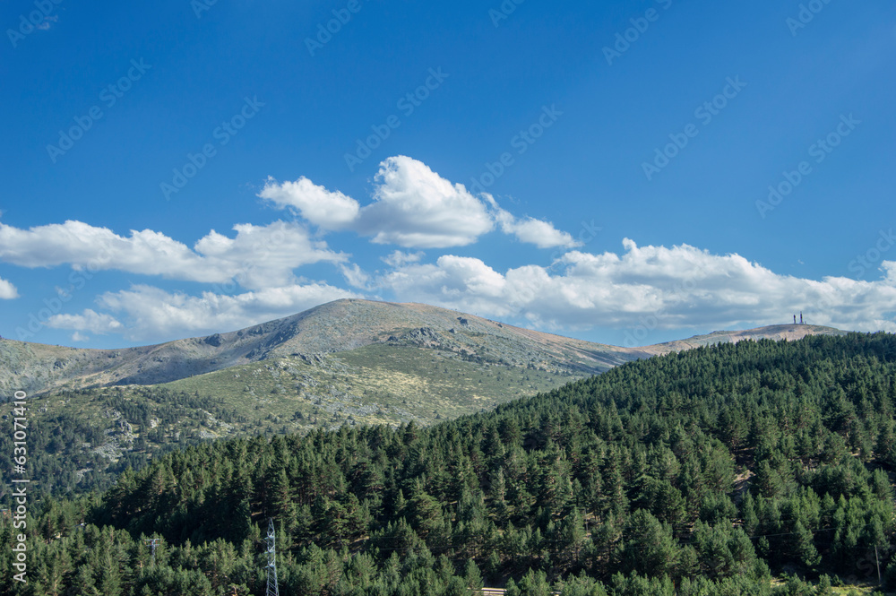 landscape with mountains and pine trees and sky with clouds from Guadarrama national park in Madrid. Spain