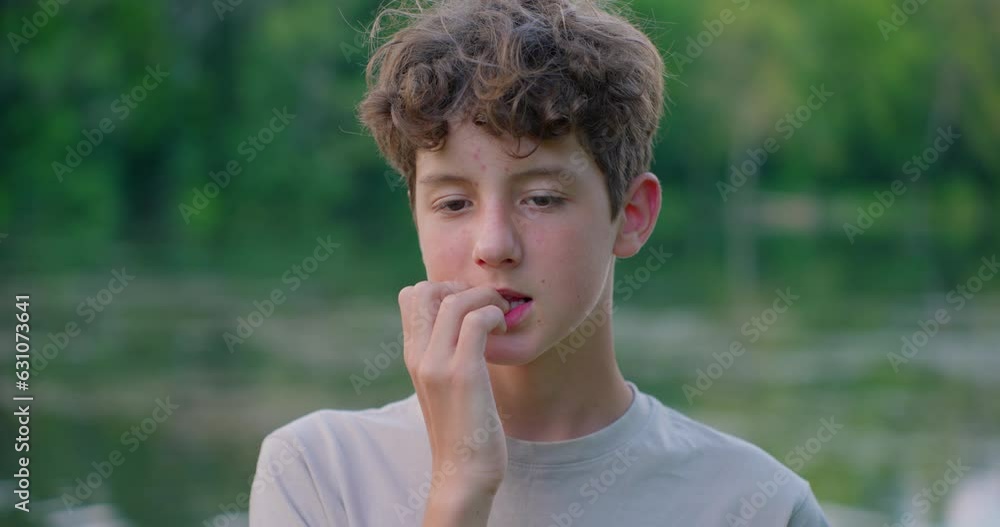 Close-up youth teenager biting nails. Adolescent problems Close-up youth teenager biting nails. Adolescent problems