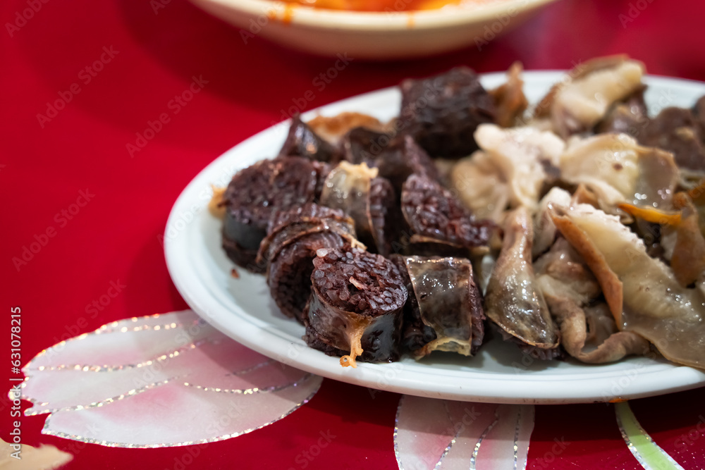 Delicious Korean cuisine Sundae and other pork edible viscera in market, street food. Delicious Korean cuisine Sundae and other pork edible viscera in market, street food.