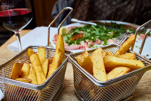 Photography French fries and a bowl with salade
