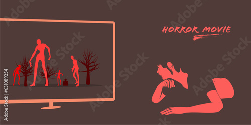 Amazed female watching horror movie while lying on floor in dark room at night