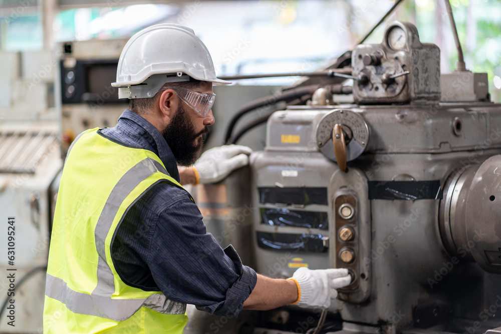 Arabic engineer man repair machine in steel metal manufacturing factory plant industry. technician worker maintenance check quality machine. Arabic engineer man repair machine in steel metal manufacturing factory plant industry. technician worker maintenance check quality machine.
