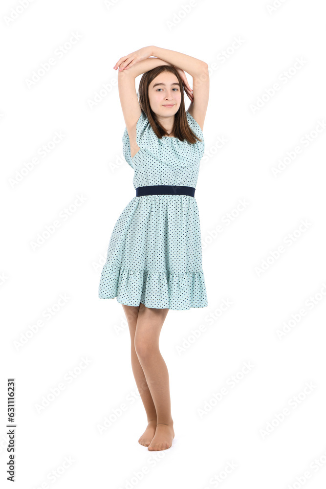 Young beautiful girl in a dress with polka dots on a white background. Young beautiful girl in a dress with polka dots on a white background.