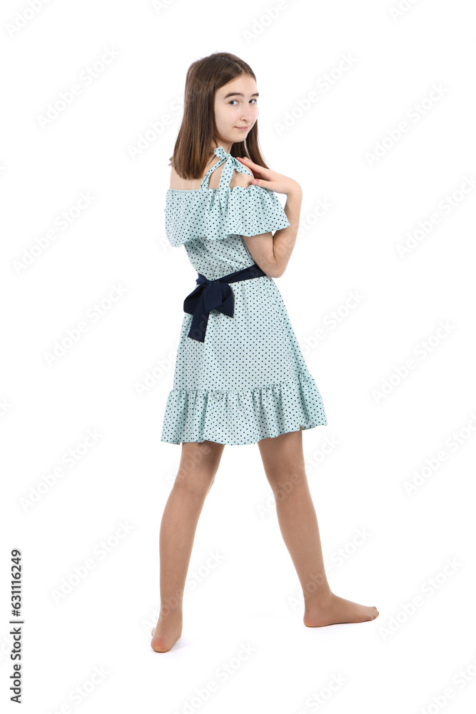 Young beautiful girl in a dress with polka dots on a white background. Young beautiful girl in a dress with polka dots on a white background.