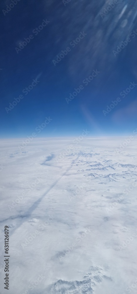 flight view over the snow-capped Alps is a breathtaking spectacle that unfolds like a majestic painting. As the plane soars above these towering peaks, the landscape transforms into a pristine winter flight view over the snow-capped Alps is a breathtaking spectacle that unfolds like a majestic painting. As the plane soars above these towering peaks, the landscape transforms into a pristine winter