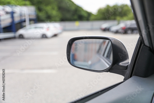 Car mirror reflects life's journeys, offering introspection and foresight. Symbolizes reflection, self-awareness and moving forward © Your Hand Please