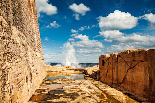 The moat cut into the rock between the old Fort St Elmo and the Mediterranean Sea is today a hiking trail photo