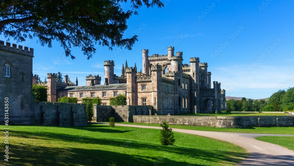 View of Lowther Castle, a picturesque historic building situated in midst of lush, verdant nature