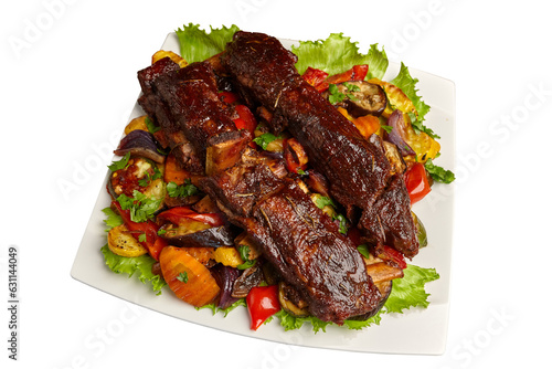 Grilled vegetables, grilled meat on a plate. Ribs, peppers, zucchini onions, carrots, tomatoes. Multicolor composition on transparent background
