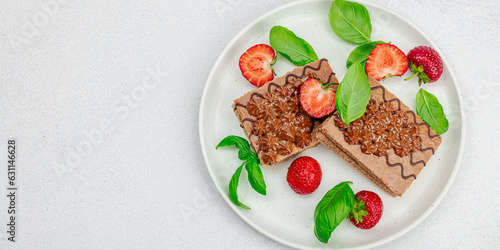 Delicious chocolate cakes with fresh strawberries. Sweet dessert, good morning concept