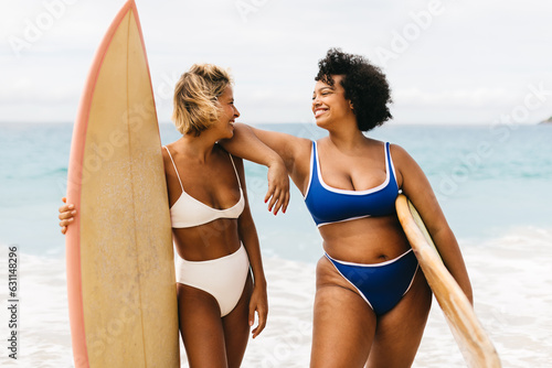 Surfing adventure: Women exploring beach life with surfboards photo