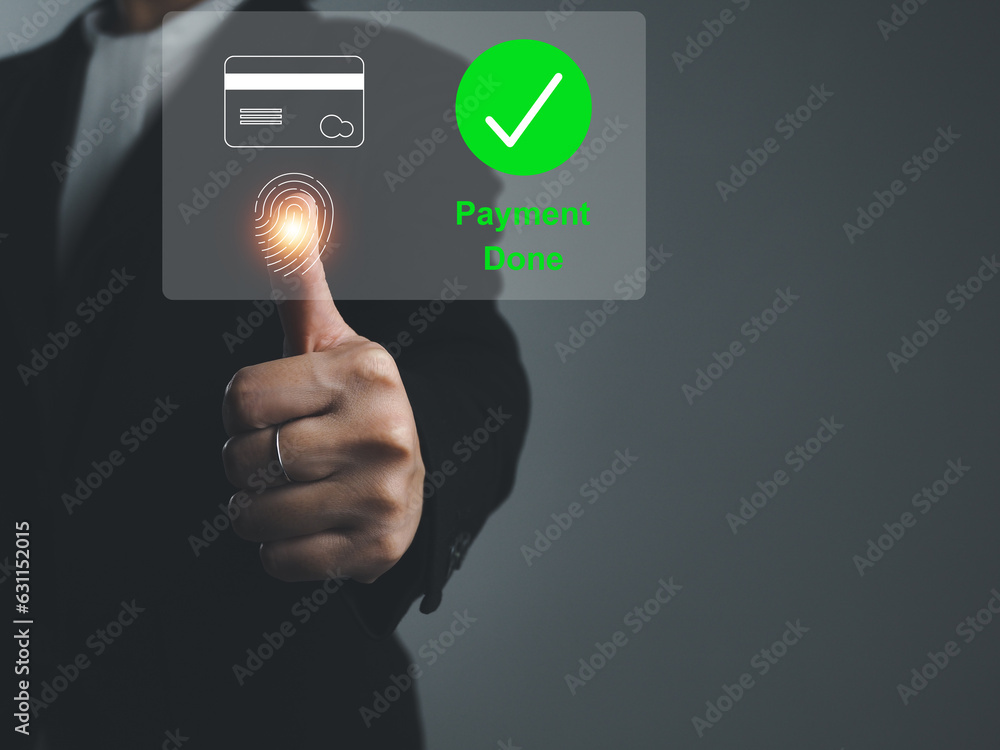 payment done Businessman paying for goods with credit card security fingerprint scan To pay for online shopping on the Internet on the virtual window payment done Businessman paying for goods with credit card security fingerprint scan To pay for online shopping on the Internet on the virtual window