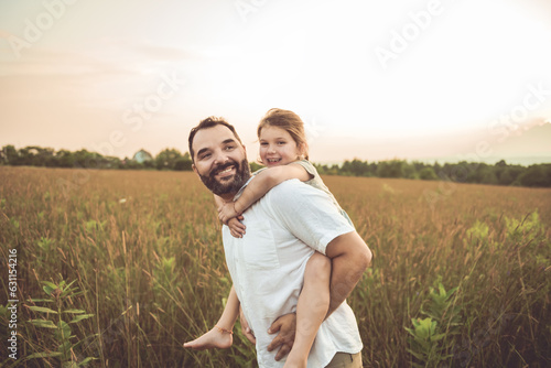 Happy family father with children daughter on nature sunset