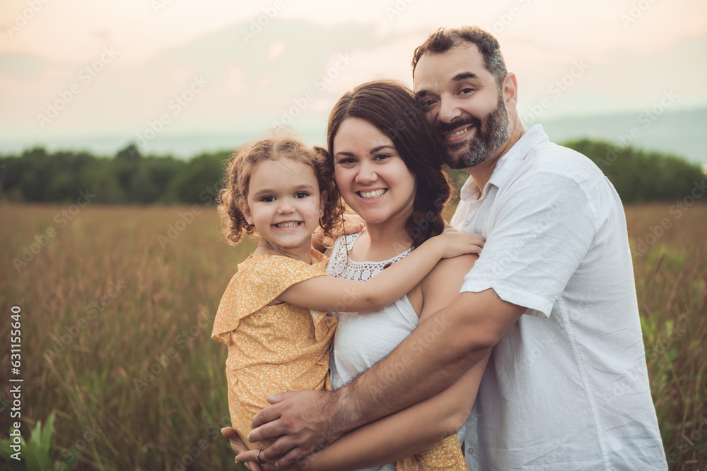 Happy family and her children daughter on nature sunset Happy family and her children daughter on nature sunset