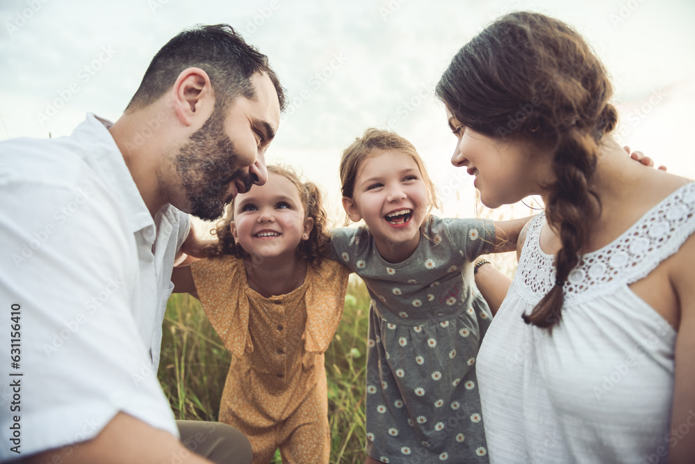 Happy family mother father and children daughter on nature sunset Happy family mother father and children daughter on nature sunset