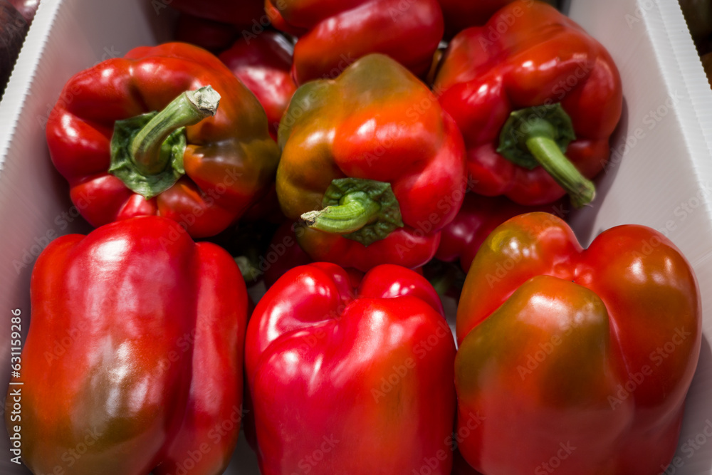 Fresh red paprika on the counter of a vegetable shop Fresh red paprika on the counter of a vegetable shop