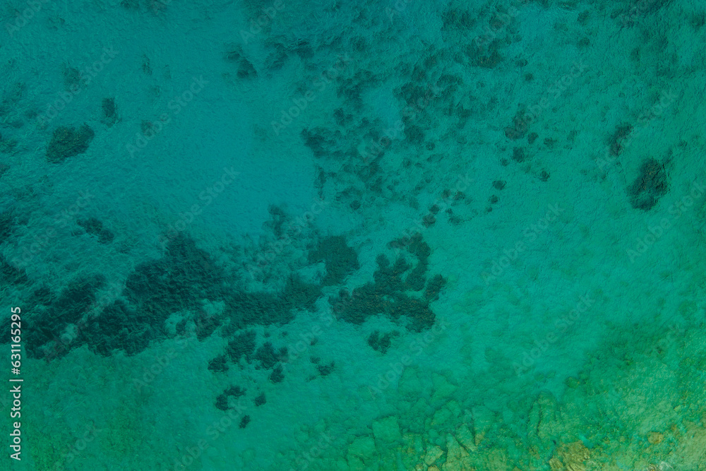 Fototapeta premium Aerial top down view of crystal sea surface water background