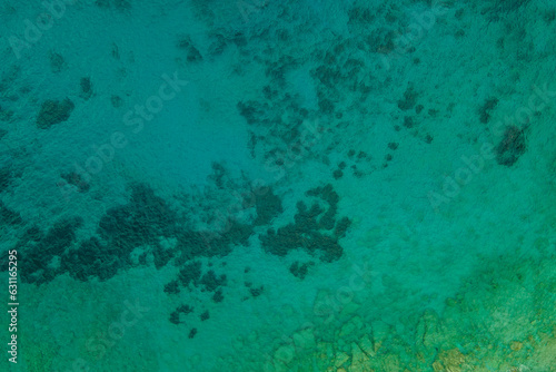 Aerial top down view of crystal sea surface water background