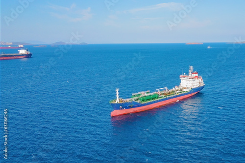 Aerial drone shot of oil chemical tankers anchored near port of oil chemical plant © Leonid