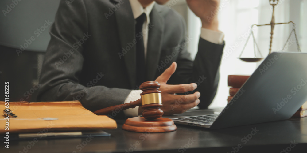 Judge gavel with Justice lawyers having team meeting at law firm background. Concepts of Law and Legal services. Judge gavel with Justice lawyers having team meeting at law firm background. Concepts of Law and Legal services.