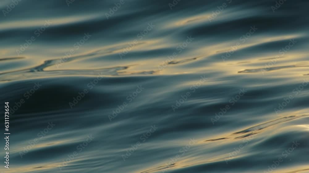 Blue water waves surface, beautiful sea surface background. Flowing clean water in motion.