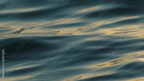 Blue water waves surface, beautiful sea surface background. Flowing clean water in motion.