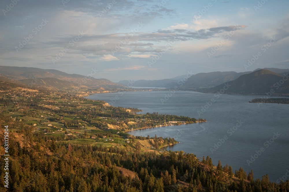 Aerial view of the tranquil Okanagan lake surrounded by lush trees in South Okanagan Valley