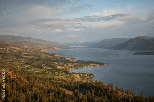 Aerial view of the tranquil Okanagan lake surrounded by lush trees in South Okanagan Valley