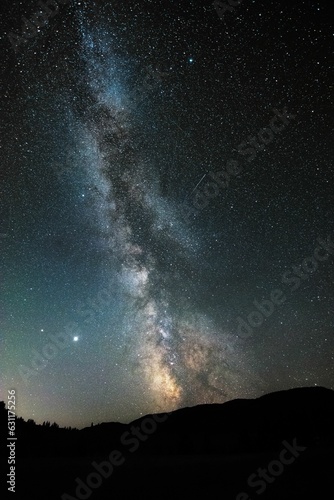 Stunning milky way night sky illuminated by stars above mountains in BC, Canada