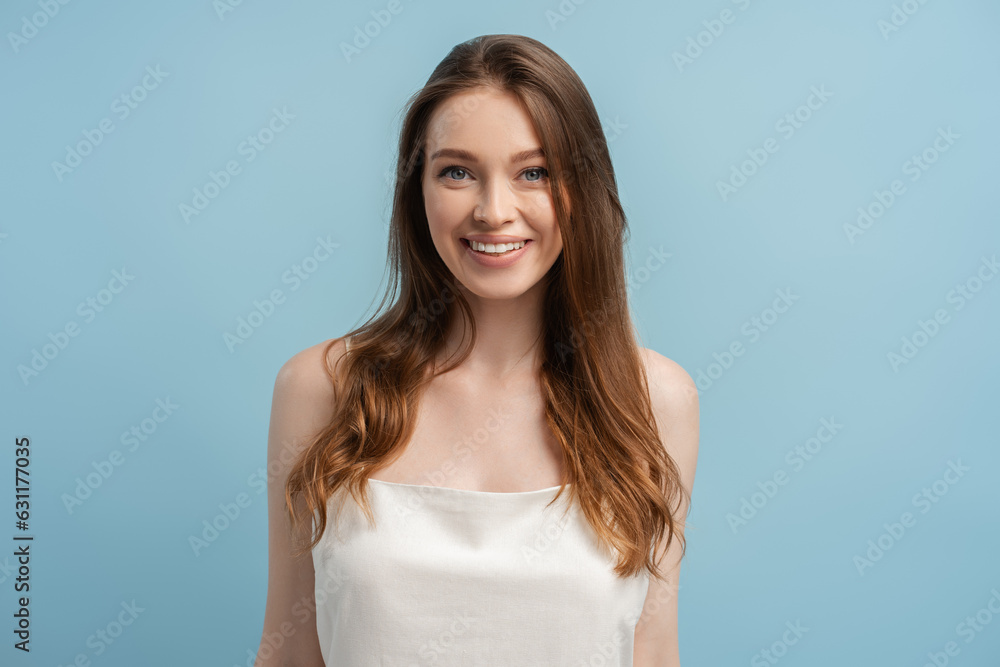 Close up portrait of beautiful smiling woman with long hair, toothy smile looking at camera Close up portrait of beautiful smiling woman with long hair, toothy smile looking at camera