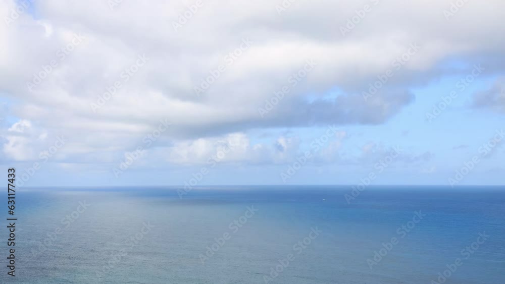 In front of you, billowing, ever-changing clouds fly across the sea.The wide sea and tumbling cloud form spectacular film.Photographed at Nantian Cultural Landscape Observation Deck, Taitung, Taiwan. In front of you, billowing, ever-changing clouds fly across the sea.The wide sea and tumbling cloud form spectacular film.Photographed at Nantian Cultural Landscape Observation Deck, Taitung, Taiwan.