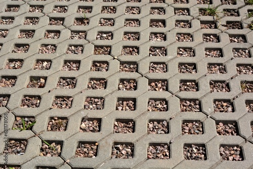 Quadro em tela Concrete openwork plates used as garden road and parking lot for cars