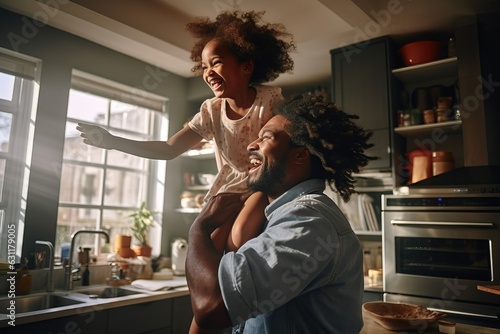 a handsome black man and his child having fun in the kitchen.