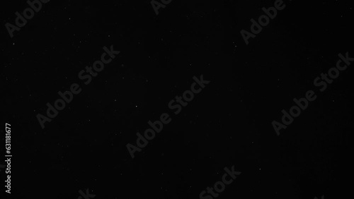 Dust Particles Floating On Black Background	
