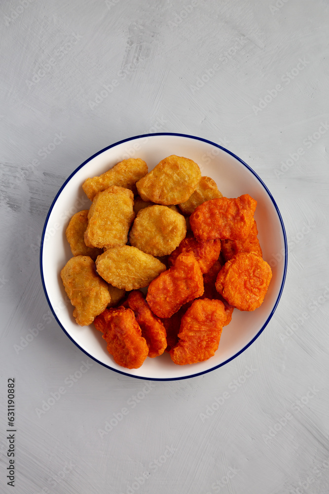 Homemade Spicy Chicken Nuggets Mix with Ketchup, top view. Homemade Spicy Chicken Nuggets Mix with Ketchup, top view.