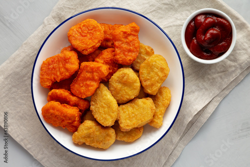 Homemade Spicy Chicken Nuggets Mix with Ketchup, top view.