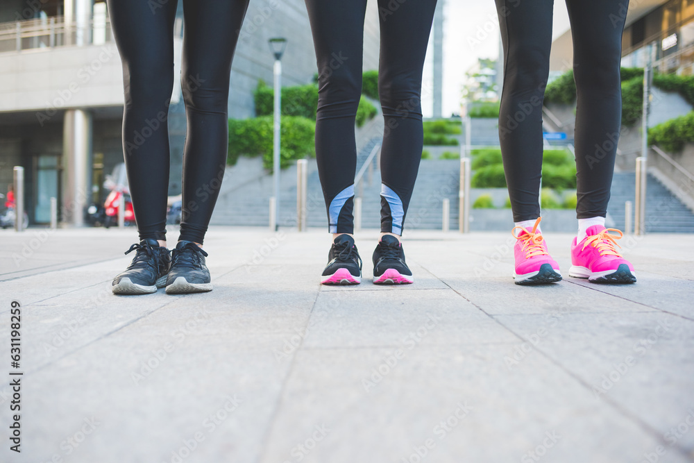 Close up women wearing jogging and running shoes outdoors Close up women wearing jogging and running shoes outdoors
