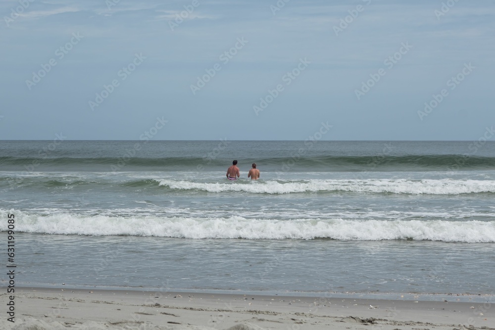 A group of people swimming in a sea, Myrtle Beach, South Carolina A group of people swimming in a sea, Myrtle Beach, South Carolina
