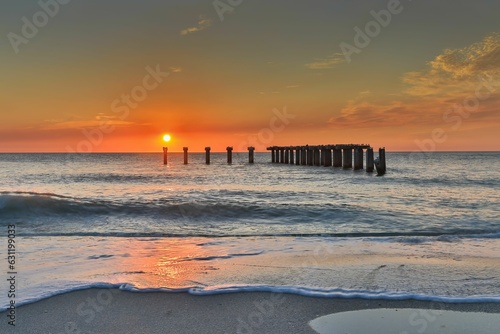 Fotografie Idyllic sunset in Florida at Boca Grande Island, featuring a picturesque old sto