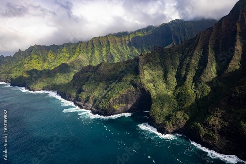 Aerial view of green mountains against the sea in Waimea Canyon State Park in Kauai County, Hawaii photo