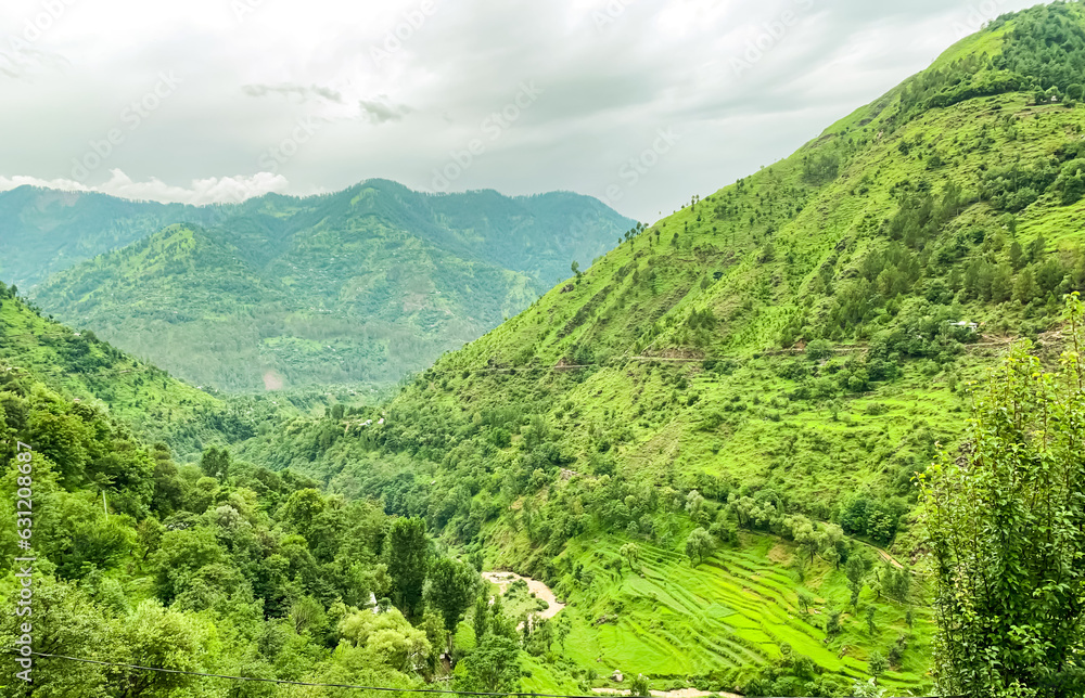 Fototapeta premium Beautiful green Mountain Valley Landscape background wallpaper with river and cloudy sky