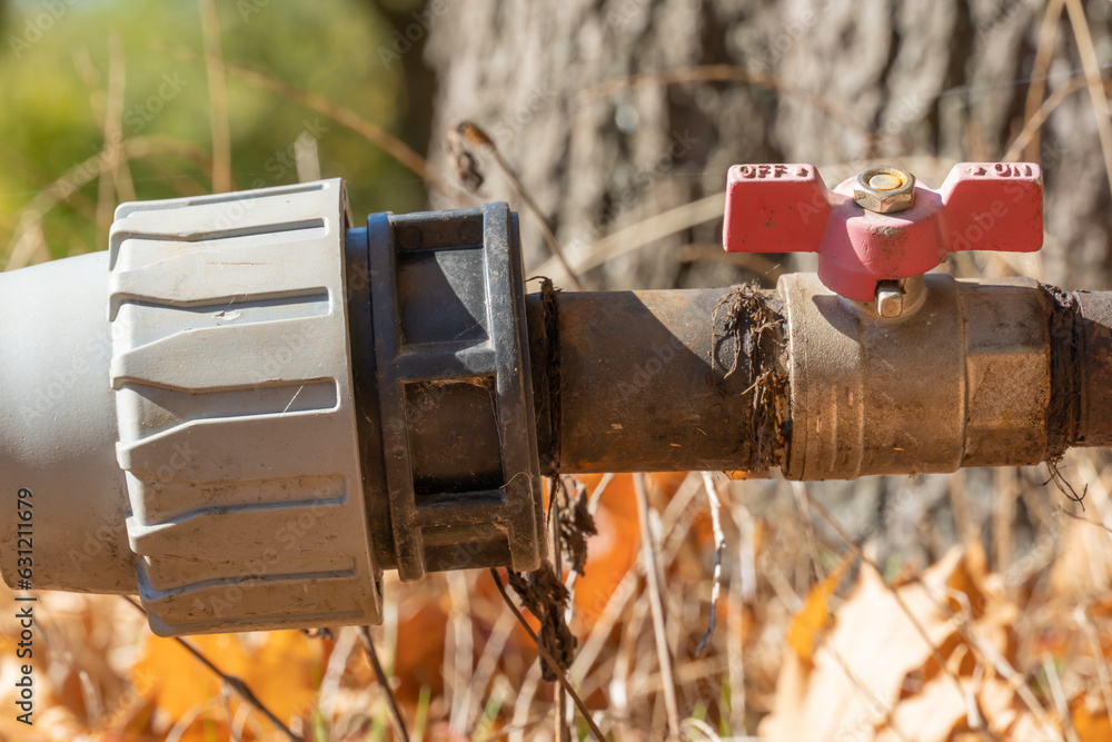 Valve and connecting pipes of old automatic watering. Turn off or turn ...