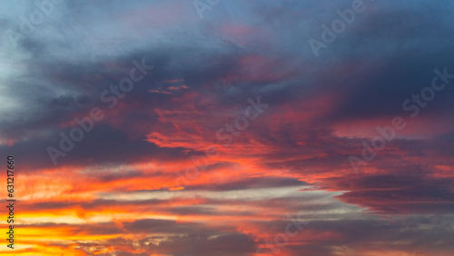 Sunset sky with vibrant red clouds, vibrant evening clouds, ideal for sky replacement in photography © Gabriele
