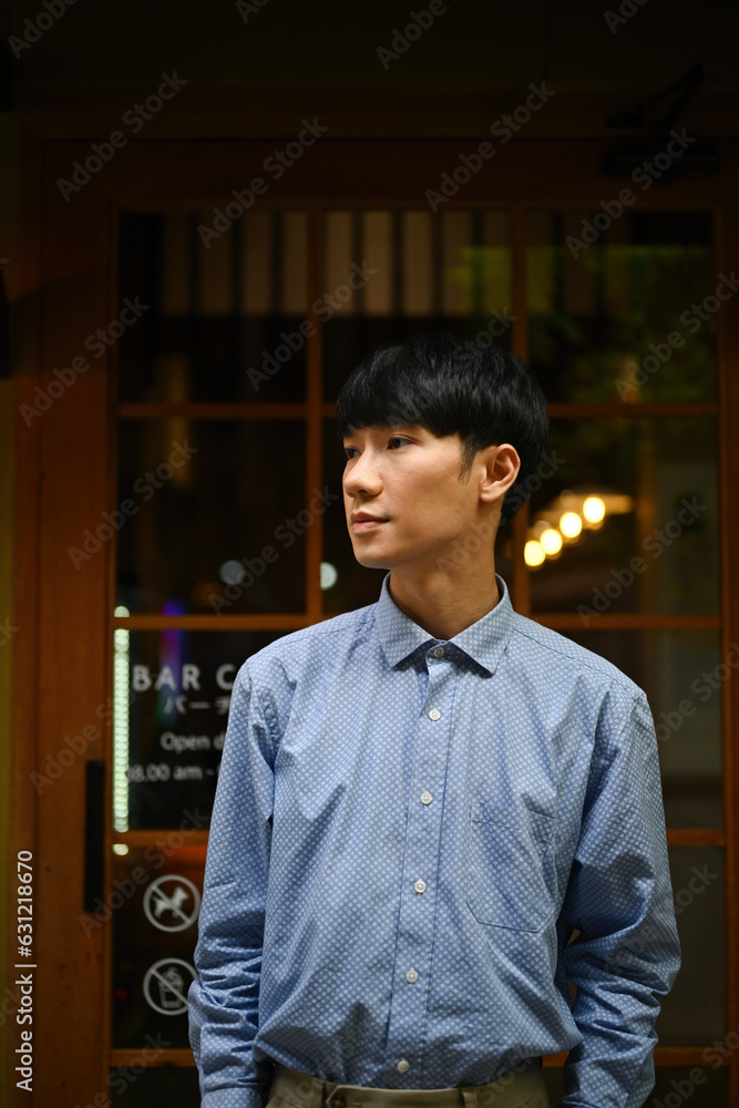 Portrait image of Young Asian male, Small Business owner, SME entrepreneurs with Japanese style restaurant on the background. Portrait image of Young Asian male, Small Business owner, SME entrepreneurs with Japanese style restaurant on the background.