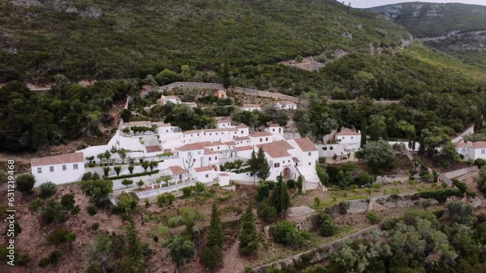 The close up drone shot view of a Convent of Our Lady of Arrabida in Arrabida Natural Park, Portinho da Arrabida, Portugal The close up drone shot view of a Convent of Our Lady of Arrabida in Arrabida Natural Park, Portinho da Arrabida, Portugal
